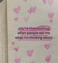 an open book with pink hearts on it and the words you're that nothing when people ask me what i'm thinking about