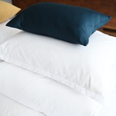 three pillows stacked on top of each other