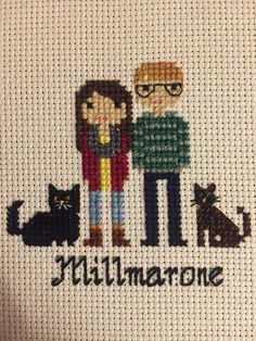 a cross stitch picture with two people and a cat on the bottom that says millaurone