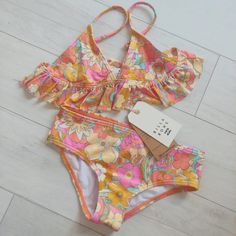 Billabong Ain't She A Beaut Ruffle Bikini Set Multi Colors Be Ready For A Day Of Making A Splash At The Beach In The Billabong Kids Aint She A Beaut Ruffle Tri Set Triangle Top With Ruffle Trim All-Over Print Adjustable Ring And Slider Straps Pull-Over Design Medium Rear Coverage Branding Embroidered On Back Of Bottom New Retail $69.95 Sz 7 Or 8 Girls Smoke & Pet Free Home Vans Volcom Billabong Roxy Quiksilver Brixton Reef Mauiandsons Ripcurl Hang Ten Hurley Gap O'neill Columbia Biker Shorts Lul Billabong Kids, Cute Summer Shirts, Billabong Girls, Swim Party, Billabong Swim, Long Sleeve Swimsuit, Spring Vacation, Hang Ten, Tank Girl