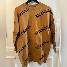 Nwt Balenciaga All Over Oversized Logo Knit Sweater. Size Small Please See All Pictures Wrinkled Only Due To Being Folded Jacquard Knit Long Sleeve Loungewear Sweater, Long Sleeve Jacquard Knit Sweater For Loungewear, Designer Brown Sweater For Winter, Designer Brown Sweater For Fall, Oversized Jacquard Knit Tops, Oversized Long Sleeve Jacquard Knit Sweater, Loose Long Sleeve Jacquard Knit Sweater, Oversized Crew Neck Brown Outerwear, Oversized Jacquard Knit Long Sleeve Tops