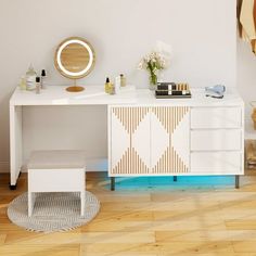 a white vanity with mirror, stool and other items on the counter in a room