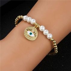 Classic Eye & Pearl Elastic Bracelet-Fashion Bracelets & Bangles-StylinArts Luxury Adjustable Pearl Bracelet With Round Beads, Luxury Adjustable Yellow Gold Pearl Bracelet, Luxury Gold-plated Pearl Bracelet, Luxury Gold-plated Pearl Bracelet For Formal Occasions, Adjustable 14k Gold-filled Elegant Pearl Bracelet, Bangles Style, Elastic Bracelet, Pearl Color, Contemporary Fashion