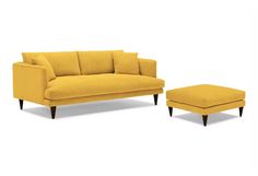 a yellow couch and footstool sitting next to each other