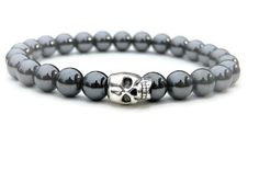 "FREE SHIPPING (United States) Our hematite beaded bracelet is unisex in design. This stone has iron in it which makes it heavier then our other stones. Hematite is great in color and helps absorb negative energy and calms in times of stress. Hematite is known as \"The Blood Stone\" for grounding, focus and confidence. These stones are sourced from Canada and is the most abundance mineral found on the Earth's surface. With each purchase you will receive a card with the above information to go al Silver Hematite Jewelry With 8mm Beads, Beaded Hematite Bracelets As Gifts, Silver Hematite Hand-strung Jewelry, Hematite Bracelet With 8mm Beads, Silver Hand-strung Hematite Jewelry, Hematite Bracelet With Round Beads As Gift, Hematite Bracelet With Polished Beads As Gift, Hand-strung Hematite Crystal Bracelet As Gift, Hematite Beaded Bracelet With Silver Beads