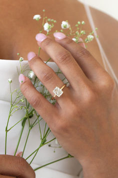 a close up of a person wearing a wedding ring