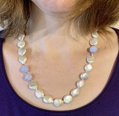 "* A lovely, luxurious Mother's Day Gift for someone special * Beautiful 14mm snow white Coin Pearls, with extremely high luster ( the pictures do not capture the true quality of these AA rated Pearls) * Equally lustrous 10mm Chalcedony Gemstone Beads, surrounded by 14K Gold Balls * The Necklace is finished with a 14K Gold Clasp * This Necklace is available in any length you prefer, up to 20\"; just add a note at checkout with your preference * Gift wrap is included Thank you for visiting my sho White High Luster Round Bead Necklaces, White High Luster Round Beaded Necklaces, White High Luster Round Beads Necklace, White Pearl Necklace With High Luster For Anniversary, White High Luster Pearl Necklace For Anniversary, White High Luster Necklace For Anniversary, White High Luster Necklace For Wedding, High Luster White Necklace For Wedding, Elegant White Jewelry For Christmas