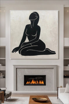 a living room filled with furniture and a fire place in front of a painting on the wall