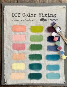 the diy color mixing towel is next to some paintbrushes