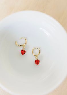 These beautiful strawberry charm hoops are a perfect huggie hoop, and make a great addition to any ear stack! These earrings are available in gold vermeil (18k gold plating over sterling silver) metal and are great for sensitive ears! Check out our other earrings here: https://www.etsy.com/shop/satinstitchdesigns?ref=l2-shopheader-name§ion_id=23495161 PLEASE NOTE: All of my items are custom made. The colors on your monitor may differ slightly from the color delivered. Please read my shop policie Huggie Earrings With Dangling Charms As Gift, Trendy Hoop Earrings With Dangling Charms As Gift, Hoop Earrings With Charms As Gift, Charm Hoop Earrings As Gift, Dangle Huggie Earrings With Charms For Gifts, Huggie Earrings With Charms For Gift, Charm Huggie Earrings For Gift, Charm Huggie Earrings As Gift, Hoop Huggie Earrings With Dangling Charms For Gifts