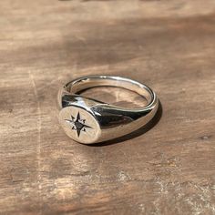 A classic small circle signet ring star-set with a 2mm black diamond. These timeless signet rings are meticulously crafted by hand in our Melbourne workshop, created out of wax and then cast into solid precious metal. Made with the highest quality Australian sterling silver to last forever. Made solid, not hollow like many others, all of our rings are hand-stamped with a Sterling Silver (925) hallmark and Custom Creed makers mark and come gift-wrapped in a branded box with satin black ribbon. Du