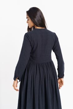 A hint of vintage to your classic black dress. This semi-formal dress fits like a dream with adorable delicate gathers around the waist, relax-fitted long sleeves, and an overlapping neckline. Tailored from handcrafted organic cotton fabric, this dress is a modern piece with a nostalgic sensibility. The fitted empire waistline will let you flaunt your curves elegantly. Fits true to size Side pockets Falls 45" from the high point of the shoulder Made in organic cotton Machine wash The model is ch Elegant Cotton Dresses For Gatherings, Elegant Long Sleeve Dress For Gatherings, Long Sleeve Midi Dress With Gathered Neckline For Daywear, Long Sleeve Dress With Gathered Sleeves For Gatherings, Cotton Dresses For Fall Gatherings, Cotton Dress For Gatherings In Fall, Fall Dresses With Gathered Sleeves For Gatherings, Fall Cotton Dress For Gatherings, Long Sleeve Dress With Gathered Neckline For Fall