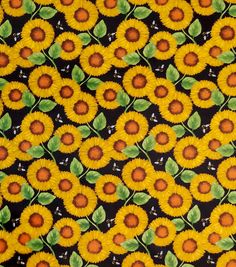 sunflowers with green leaves and brown centers on a black background that looks like fabric