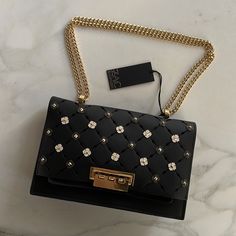 Nwt - Zac Posen - Eartha Medium Chain Shoulder Bag - Black - Leather - Gold Chain - Protective Sticker - No Dust Bag Or Box Luxury Bags With Gold Chain For Party, Luxury Shoulder Bag With Gold Chain For Party, Luxury Black Shoulder Bag With Gold Chain, Luxury Evening Bags With Gold Chain, Luxury Evening Bag With Chain Strap For Night Out, Elegant Party Shoulder Bag With Branded Hardware, Elegant Party Bags With Branded Hardware, Elegant Leather Evening Bag With Chain, Elegant Chain Bag For Night Out