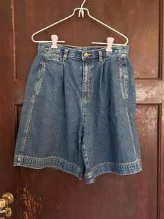 The absolute cutest vintage denim tailored shorts.  These 90's mom shorts are perfect for summer and the summer/fall transition.  They could be styled so many ways from preppy to minimalist to coastal grandma to granola core.   They will be a staple in your wardrobe!  Brand: Liz Claiborne Lizwear Size:  tag cut out- see measurements for best fit!  Waist: 29"  length: 19.5" inseam: 8" #momshorts #tailoredshorts #denimshorts #highwaistedshorts #retro Cheap Vintage Medium Wash Shorts, Vintage Denim Jean Shorts For Summer, 90s Inspired Denim Jean Shorts For Summer, Vintage Jean Shorts For Summer, Vintage Medium Wash Relaxed Fit Shorts, Retro Medium Wash High-waisted Jean Shorts, Retro High Waist Relaxed Fit Jean Shorts, Vintage High-waisted Jean Shorts For Spring, 90s High Waist Relaxed Fit Jean Shorts