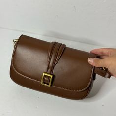 Zara Crossbody Bag With Buckle. Crossbody Bag. False Metal Buckle On The Front. Lined Interior. Adjustable And Detachable Strap. Magnetic Clasp Closure On The Flap. Caramel Brown Height X Length X Width (14 X 22 X 4 Cm) 5.5 X 8.6 X 1.5″ In Excellent Condition, Never Used, Nwot Brown Baguette Shoulder Bag With Hasp Closure, Chic Brown Baguette Bag With Hasp Closure, Brown Baguette Bag With Adjustable Strap For Office, Elegant Flap Shoulder Bag With Mobile Phone Pocket, Brown Office Flap Bag With Single Shoulder Strap, Brown Rectangular Flap Bag With Single Shoulder Strap, Brown Crossbody Baguette Bag With Phone Pocket, Brown Crossbody Baguette Bag With Mobile Phone Holder, Elegant Brown Flap Bag With Single Shoulder Strap