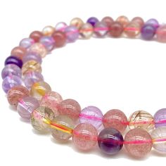 two stranded bracelets with pink and purple beads