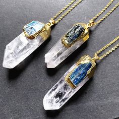 Listing is for one Crystal Quartz with Blue Kyanite pendant. Size:  Irregular stone but about 48-60mm (L) x 12~20mm (W) Packages include: pendant  you can choose just pendant OR pendant with chain necklace Metal color: gold plated Each one is unique. thank you! we will send the one as picture shown by random. thank you. Blue Mineral Crystal Necklace For Gift, Blue Raw Stone Crystal Necklace Gift, Blue Raw Stone Crystal Necklace As Gift, Blue Raw Stone Spiritual Jewelry, Blue Raw Stone Jewelry For Gift, Spiritual Blue Raw Stone Jewelry, Beta Quartz, Blue Kyanite, Crystal Quartz