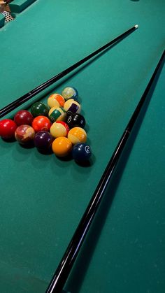 billiards and pool balls on a green table