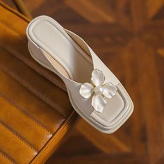 Step into summer with style and comfort with our Elegant Pearl Flower High Heel Wedge Slides. These chic wedge sandals are a must-have for any fashion-savvy woman looking to add a touch of elegance and sophistication to her warm-weather wardrobe. Designed with a thick bottom and adorned with a delicate pearl flower, these slides are not just stylish but also incredibly comfortable. Key Features High-Quality PU Upper: Durable and easy to clean, providing a sleek look. Comfortable Wedge Heel: Measures between 5cm to 8cm, perfect for enhancing posture without sacrificing comfort. Stylish Pearl Flower Accents: Adds a subtle glamour to your everyday outfits. Rubber Outsole: Offers excellent traction and durability. Adjustable Fit: Ideal for those with slightly wider or narrower feet. When to We Wedge Slides, Men Shoes Formal, High Heel Wedges, Woman Looking, Heels & Wedges, Pearl Flower, Mens Shoes Boots, Hair Accessories Jewelry, Flat Boots