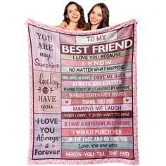 two women holding up a blanket with the words best friend on it and an i love you