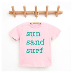 Looking for a cute tee for your kids? We have the perfect Sun Sand Surf graphic tee addition to their closet! Also available in youth tees. Surf Graphic, Trending Graphic Tees, Sand Surfing, Minnie Mouse Bow, Bow Shorts, Minnie Mouse Girl, Kids Clothes Boys, Top Graphic Tees, Kids Outfits Girls