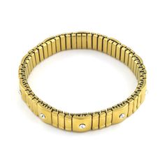 Adorn your wrist with the exquisite Gus Bracelet. Its unique stretch style allows for a perfect look on any wrist, while its brushed gold look exudes luxury. The sparkling crystal accents add a touch of elegance to any outfit. Elevate your style with this exclusive piece. Bracelets are 'one size fits most' and are designed to fit up to a 7.5" wrist comfortably. Lead & Nickel Free Please be aware that due to the unique and handmade nature of each product, colors, shapes, and bead sizes may vary s Gold Jubilee Stretch Bracelet For Formal Occasions, Elegant Gold Stretch Bracelet With Jubilee Style, Elegant Gold Stretch Bracelet For Formal Occasions, Formal Gold Metal Stretch Bracelet, Elegant Gold Stretch Bracelet Stackable, Luxury Gold Crystal Bracelet, Luxury Gold Crystal Metal Bracelet, Luxury Gold Metal Crystal Bracelet, Modern Gold Stretch Bracelet For Gift