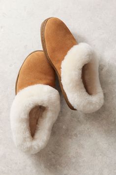 Cloudlike softness meets lasting warmth and durability with the Tasha shearling-lined slippers. With soft cow suede leather uppers and premium 100% Australian Merino sheepskin lining and fluffy collars, these slip-ons will keep you cozy for years to come. Best of all, the slippers' flexible indoor/outdoor rubber outsoles allow you to grab the mail or warm up the car without slipping or marring the lovely suede and shearling. Includes a memory foam midsole for luxurious comfort and durability. Classic Indoor Slippers, Winter Faux Fur Lined Slippers, Cozy Indoor Suede Slippers, Cozy Slippers With Suede Lining And Round Toe, Cozy Slip-on Slippers With Suede Lining, Classic Sheepskin Slippers For Winter, Suede Slippers With Plush Lining And Round Toe, Cozy Brown Shearling Slippers, Sheepskin Slippers With Plush Lining