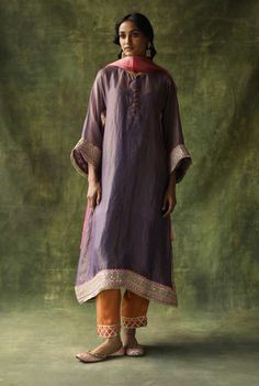 Editor's Note A Contrast Kurta Set In Chanderi Silk With Gota Embroideries On The Sides, Sleeves And The Ghera. The Pants Are A Contrast Pop With Hand Embroidered Floral Bootis. The Dupatta With Hand Made Tassels Add A Further Festive Pop To The Outfit. Color: Purple Fabric: Chanderi Silk Kurta, Modal Satin Lowers, Sat Blouse Yoke, Personal Shopping Service, Silk Kurta, Organza Dupatta, Purple Fabric, Satin Slip, Kurta Set, Color Purple, Occasion Wear