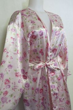 "Designer Floral Robe Kimono Style Heavenly and of so feminine! Wonderful high quality Oscar de la Renta robe from the 1990s Pink Label Heavy weight satin in a rose floral Sweeping full length Excellent condition. Small Bust 46\" 55\" length 20\" shoulder 15\" sleeve from underarm. Easy care polyester...washes like a dream Your boudoir will never be the same! https://www.etsy.com/shop/BelindasStyleShop" Vintage Pink Robe For Spring, Pink Satin Spring Robe, Tap Pants, Mode Kimono, The Wedding Singer, Vintage Nightgown, Never Be The Same, Floral Robes, Kimono Style