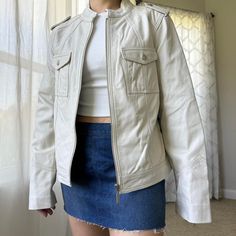 New With Tag, Vintage Moto Jacket In Genuine Lambskin Leather. Color Is A Bone Creme Color. Features: 100% Genuine Lambskin Leather 100% Polyester Lining Button Pockets Main Zipper Closure Era: 00s Brand: Attention Made: China Tag Size: 10 May Fit Multiple Sizes, Xsmall To Large Due To Cut But Please Check Below To Ensure Desired Fit As There’s Only One For Sale. Approximate Measurements, Taken Flat In Inches: Pit To Pit 19.5 Open Hem 19.5 Length 22.5 Shoulder To Shoulder 16 Sleeve 24.25 Conditi Beige Fitted Biker Jacket With Zipper Closure, Beige Casual Leather Jacket With Button Closure, White Leather Jacket With Pockets For Work, Casual Fitted Biker Jacket, Casual Cream Biker Jacket With Long Sleeves, Spring Fitted Biker Jacket With Snap Buttons, Fitted Biker Jacket With Snap Buttons For Spring, Fitted Cream Biker Jacket With Long Sleeves, Fitted Spring Biker Jacket With Snap Buttons