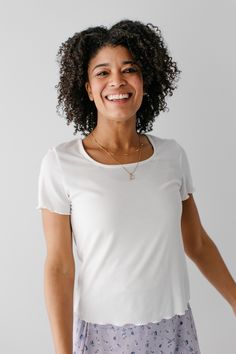 The 'Rory' Tee is the epitome of effortless sophistication and comfort. The square neckline adds a touch of contemporary flair, and subtle dimension is created through its ribbed texture. Pair with a flowy midi skirt and a pair of sneakers for a feminine and casual look! 60% Polyester 35% Rayon 5% Spandex Machine Wash Cold Gentle Cycle Do Not Bleach Hang to Dry Low Iron if Needed Do Not Dry Clean Model in Ivory Height 5'9" | Wearing Size Small (slightly sheer, may require layering) Wearing 'Rory Flowy Midi Skirt, Distressed Denim Skirt, Floral Midi Skirt, Layered Tops, Ribbed Texture, The Square, Floral Chiffon, Low Iron, Skirt Leggings