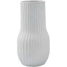 a white vase sitting on top of a table