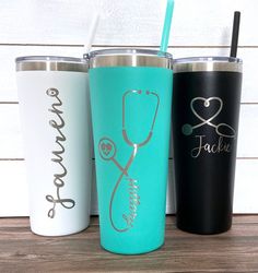 three different colored tumblers with stethoscope and doctor's symbol on them