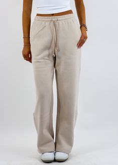 Stay cozy and stylish with these straight leg sweatpants! Featuring a relaxed straight-leg design with convenient pockets and a drawstring waist, these sweatpants are perfect for lounging or running errands. The soft fabric ensures all-day comfort, while the versatile beige hue makes them easy to style with your favorite casual tops. The Details Pockets Drawstring Waist Straight Leg 50% Cotton, 50% Polyester [#other] Machine Wash Cold with Like Colors Tumble Dry Low for 5 Minutes, Then Hang to D Comfortable Straight Leg Pants With Drawstring, Trendy Solid Color Sweatpants For Everyday, Trendy Sweatpants For Everyday Wear, Comfortable Sweatpants With Straight Hem For Lounging, Beige Drawstring Sweatpants For Loungewear, Comfortable Fall Straight Leg Joggers, Trendy Sweatpants For Lounging, Cozy Leisure Pants For Spring, Comfortable Straight Leg Joggers For Fall