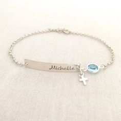 Hand Stamped Baby Boy Baptism Bracelet, Cross Jewelry, First Communion Gift, Baby Girl Bracelet, Christening Gift, Gift for Godchild♥ Now is available in 14K Rose Gold Filled♥ Available in Sterling Silver and 14K Gold Filled♥ Please be sure to drop a name and month of birthstone in the note box at checkout.♥ Specification. All component is Sterling Silver or 14K Gold Filled. Bar size 5 x 30mm. Cross size 4.4 x 7.2mm. Birthstone size 7mm. Thicker Rolo Chain. Comes in a satin pouch. Length include Adjustable Silver Name Bracelet For Baptism, Personalized Cross Rosary Bracelet For Baptism, Silver Name Bracelet With Birthstone For Wedding, Silver Wedding Name Bracelet With Birthstone, Silver Bracelet For Baptism Mother's Day, Personalized Silver Name Bracelet For Baptism, Personalized Silver Jewelry For Baptism, Custom Name Silver Jewelry For Baptism, Silver Name Jewelry For Baptism