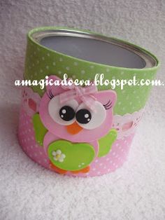 a green and pink cup with an owl on it