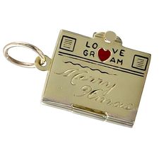 Lovely Christmas charm: a figural "telegram." 14K yellow gold, with a red enamel heart and black enamel lettering on the top of the "LOVEGRAM." "MERRY XMAS" engraved in center. Opens to reveal 2 blank pages, which can be hand-engraved with a personal message. 3/4" x 1/2." Alice Kwartler has sold the finest antique gold and diamond jewelry and silver for over forty years. Unusual Rings, Charm School, Gold Charms, Christmas Pins, Locket Charms, Christmas Charms, Merry Xmas, Red And Gold, Hand Engraving