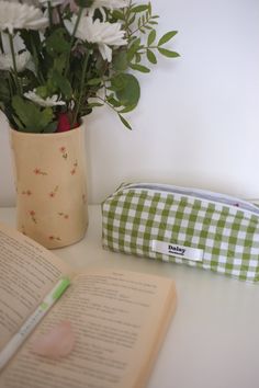 Quilted olive gingham pencil case with ivory lining and a white zip.  Perfect for gifting for students  Handmade in the UK 📏 Measurements  22cm x 7cm x 7cm  size may vary slightly as everything is handmade by me :) 🧺 Materials  Exterior 100% cotton Interior 100% cotton Padding 100% polyester Nylon zip 🧼 Care Instructions Do not machine wash, gently hand wash and air dry. Do not iron.  📦 Shipping Please allow up to one week for your order to be shipped as I have to sew each individual order :) Feel free to message me any questions  Other colours and patterns available at:  To view all products go to: https://www.etsy.com/uk/shop/DaisyHandmadeShopUK?ref=simple-shop-header-name&listing_id=1415842980 Quilted Pencil Case, Aesthetic Pencil Pouch, Pencil Pouch Aesthetic, Pencil Case Aesthetic, Pencil Case Pattern, Pink Pouch, Pouch Handmade, Fabric Combinations, Gingham Check