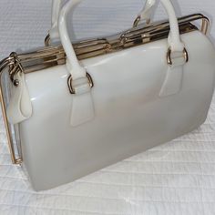 Pre-Owned Rubber Hand Bag With Metal Framed Closure , To Close Simply Slide The End Straps And Bring Towards Middle *** Please Note There Are Some Stains To Hand Bag**** Pictures Available Interior Is Brand New, Has Not Been Used, Is In Great Condition, Very Unique Purse Is A Little On The Heavier Side Due To Material Vintage White Satchel For Shopping, Cream Handbag, Unique Purses, Candy Bags, Hand Bag, Tote Handbags, Metal Frame, Jelly, The End