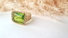 14k Gold Peridot Ring: ♥ Gemstone Type - Peridot (Lab Created) ♥ Gemstone Size - 13x18mm ♥ Gemstone Cut - Rectangle ♥ Metal Type - 14k Gold Filled - (Other options available in the drop-down menu) ♥Tarnish Resistant This Fine 14k Gold Peridot Ring is sure to grab compliments, dress up your casual outfit with a remarkable large stone ring, Gold Statement Ring made of 14k Gold-filled wire crochet statement band with Precious Stone - Peridot Rectangle. This Green Stone ring will make any woman feel Elegant Handmade Peridot Rings, Handmade Elegant Peridot Rings, Handmade Yellow Gold Rectangular Rings, Elegant Rectangular Peridot Rings, Handmade Green Rectangular Ring, Rectangular Green Peridot Rings, Gold Peridot Ring, Ring Green Stone, Green Stone Ring