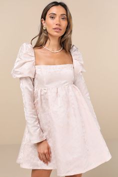 Why dream about looking adorable when the Lulus Lavish Sweetie Blush Jacquard Puff Shoulder Babydoll Mini Dress can make it a reality! Luxe woven jacquard, with a romantic floral design throughout, shapes this dress that has a cutesy babydoll silhouette with a princess-seamed bodice, a square neckline, and long sleeves with dramatic puff shoulders (and hidden no-slip strips). The extra high waist tops a twirl-worthy, skater-style skirt that ends at a flirty mini hem. Slender tying strap secures Puff Shoulder Dress, Knot Tie Dress, Babydoll Mini Dress, Puff Sleeve Dresses, Floral Jacquard, Jacquard Dress, Skater Style, Style Skirt, Tie Dress