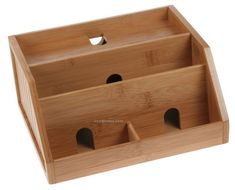 a wooden box with three holes in it