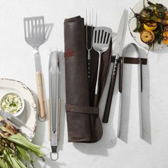 the utensils are laid out next to each other