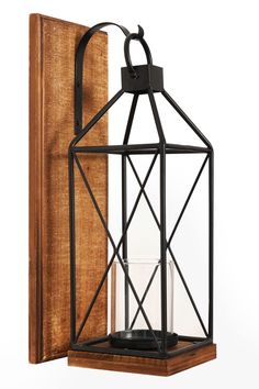 PRICES MAY VARY. Homemory Wall Candle Sconce is composed of hanging wooden board, metal candle lantern and windproof glass holder. It is suitable for burning tea candles or pillar candles, and can also directly place flameless candles within 3.3 inches in diameter. Versatile: Perfect for hanging in various places in the house, porch, living room or bedroom, add embellishment to your life. Suggest Candle Size: 1.5"-3.25" in diameter, 1.5"-8" in height. If you are using burning candles, be aware o Wall Decorations For Living Room, Metal Candle Lanterns, Wall Mounted Candle Holders, Hanging Candle Lanterns, Decorations For Living Room, Hanging Candle, Rustic Candle, Wall Candle, Lantern Candle Decor