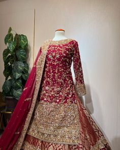 Luxury Pakistani Bridal Dress in Lehenga Kameez Style is an embellished attire in premium quality work. Goldwork, floral designs, and zardosi make this Lehenga Dress an epitome of beauty. Detailed Description: SKU: BS2512 Detailing: Embroidery, Motifs, Naqshi, Sequins, Kora, Dabka, Zardosi, Crystals, Beads Color: Red, Orange Fabric: Organza, Jamawar, Net Design: Fully Embellished Dress with Embroidery Event: Bridal wear, Wedding Dabka Embroidery Design, Kora Dabka Work Embroidery, Lehenga Kameez, Kameez Style, Dabka Embroidery, Nameera By Farooq, Lehenga Dress, Net Design, Dresses Pakistani