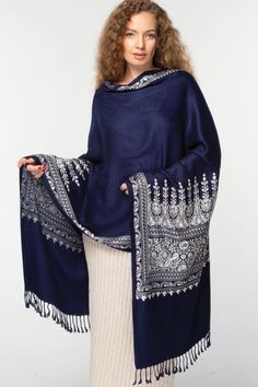 Our Vimala Embroidered Shawl features exquisite embroidery on soft 100% viscose that has the look and feel of wool, but can be worn by people with wool sensitivities. This classically beautiful shawl showcases the intricate embroidery traditions of Northern India with white embroidery on a rich navy blue base. Sevya offers a stunning collection of embroidered Indian shawls, in a range of patterns and colors to suit any occasion. Luxury Blue Shawl Dupatta, Luxury Blue Bohemian Shawl, Luxury Embroidered Blue Shawl, Bohemian Embroidered Winter Pashmina Shawl, Elegant Embroidered Shawl For Fall, Elegant Embroidered Fall Shawl, Winter Festive Embroidered Pashmina Shawl, Embroidered Pashmina Shawl For Fall, Winter Floral Embroidery Shawl