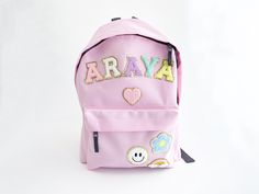 Personalised Backpack Customisable Backpack Letter Backpack Back to school kindergarten backpack Junior gift children Introducing our delightful collection of backpacks, specially designed for young adventurers and ideal for kindergarten and young children. Crafted with utmost care and attention to detail, these backpacks offer the perfect blend of comfort, safety, and style to make every day a joyful exploration. Padded adjustable shoulder straps. Zippered front pocket. Padded back panel. Grab Kawaii Rectangular Backpack, Kawaii Rectangular Backpack Gift, Kawaii Rectangular Backpack Perfect For Gifts, Trendy Pink Bag For School Events, Trendy Pink Bags For School Events, Playful Pink Softback Backpack, Pink Kawaii Backpack Gift, Playful Pink Backpack For Back To School, Trendy School Backpack For End Of School Year