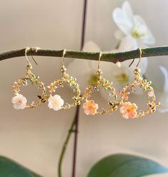 Beautiful, very classy flower Earrings, colour Gold. They have a little bee, a little flower, three gemstones and two tiny flowers on them.  You can choose them with a white flower or a rosa flower. Elegant to wear, and goes with every outfit.  The Wreath is approximately 2.2cm x 2.2cm. Choose between 18K Gold Plated HOOK and the inner layer is stainless steel or Iron HOOK. 🎁All items will come gift-wrapped in a bag and wrapped in quality tissue paper. Perfect as a gift for several occasions su Whimsical Gold Flower Earrings, Gold Whimsical Jewelry In Flower Shape, Gold Flower-shaped Whimsical Jewelry, Dainty Gold Earrings With 3d Flowers, Whimsical Gold Flower-shaped Jewelry, Delicate Flower-shaped Hoop Earrings For Gift, Delicate Flower Hoop Earrings For Gift, Delicate Flower-shaped Hoop Earrings As Gift, Delicate Flower Shaped Hoop Earrings As Gift