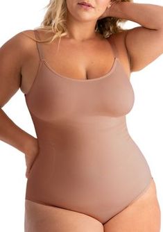 Enjoy the perfect blend of comfort and tummy control with this must-have bodysuit! Seamless fabric creates a smooth silhouette. 360 tummy control Mid-section smoothing Adjustable straps for customizable support Adjustable snap button gusset for movement & extended gusset for easy reach Composition: Body: 90% Nylon, 10% Spandex. Gusset: 100% Cotton. Sizing: True to size. Care instructions: Machine wash cold. Only nonchlorine bleach when needed. Line dry. Do not iron. | Shapermint Essentials Women Smoothing Second-skin Camisole Shapewear, Seamless Scoop Neck Shapewear, Shaping Camisole Bodysuit Shapewear, Full Coverage Solid Color Smoothing Camisole, Full Coverage Smoothing Camisole, Second-skin Scoop Neck Shapewear, Solid Color Shaping Camisole With Smoothing Details, Solid Second-skin Scoop Neck Shapewear, Spaghetti Strap Shapewear Bodysuit With Smoothing